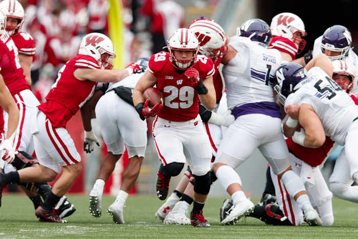 Wisconsin running back Brady Schipper running against Northwestern in 2021 (Credit: Jeff Hanisch-USA TODAY Sports)